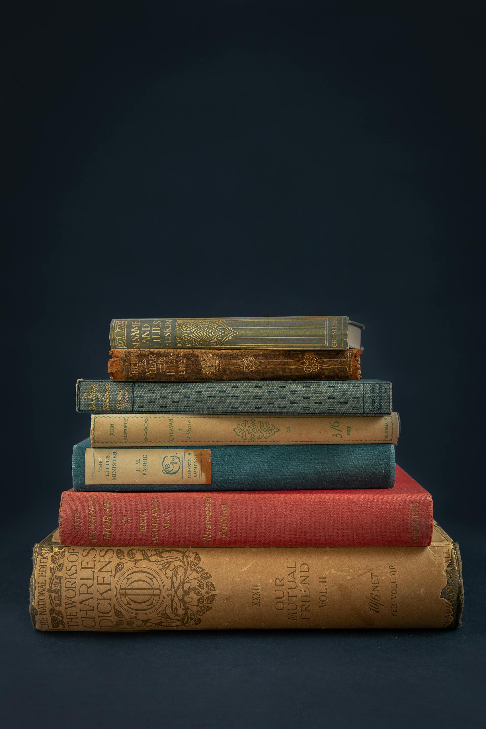 An elegant stack of vintage books creates a classic and timeless feel.